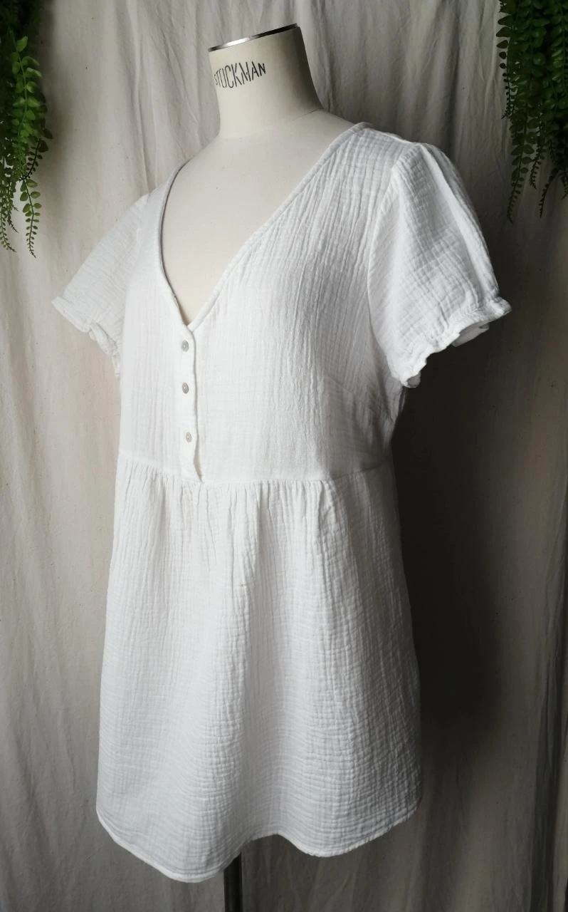 Blusa branca corte babydoll gaze de algodão texturizado "Kiabi" – photo 2